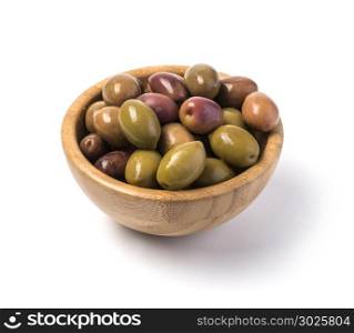 green olives at wooden bowl isolated on white