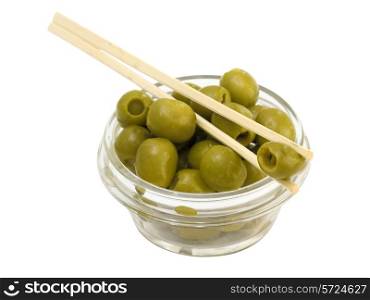 Green olives in a bowl on a white background