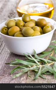 green olives on wooden table