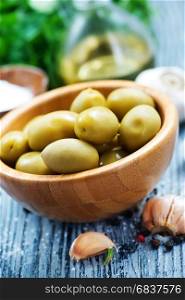 green olives with spice in the bowl