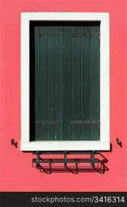 Green on red. Green window on red wall
