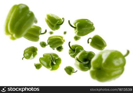 Green paprika levitates on a white background.. Green paprika levitates on a white background