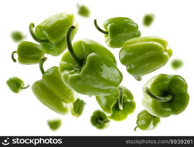 Green paprika levitates on a white background.. Green paprika levitates on a white background