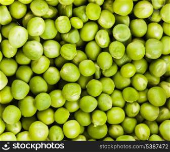 Green pea with waterdrops scattered as a background