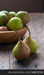 Green Pears in Wooden Plate On The Table
