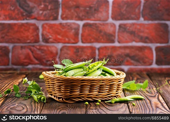 green peas in basket and on a table