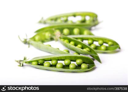 green peas on a white background. raw diet