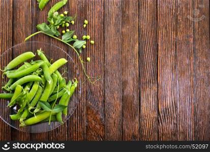 green peas on plate and on a table