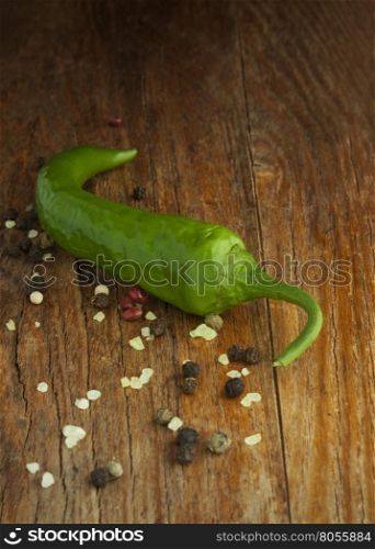 Green pepper on wood background
