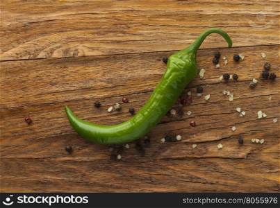Green pepper on wood background