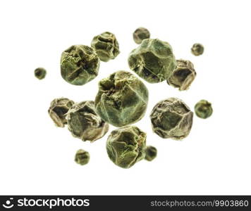 Green peppercorns levitate on a white background.. Green peppercorns levitate on a white background