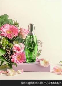 Green perfume bottle on podium with flowers bunch, front view. Natural floral scent