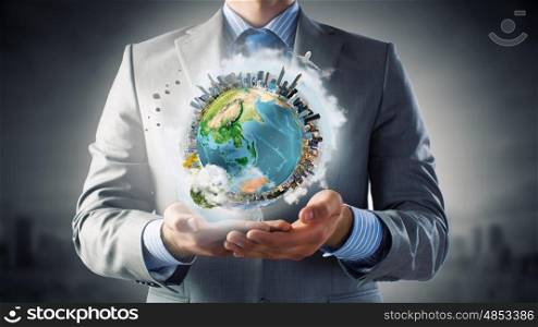 Green planet. Businessman hands holding Earth planet. Elements of this image are furnished by NASA