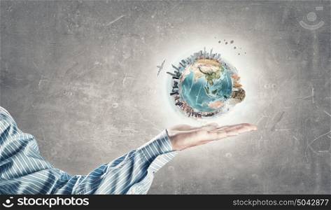 Green planet. Close up of human hands holding Earth planet. Elements of this image are furnished by NASA