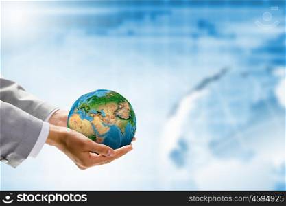 Green planet. Image of Earth planet in human hands. Protect planet. Elements of this image are furnished by NASA