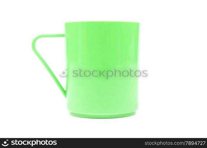 Green plastic glass. Isolated on white background. Taken in the studio