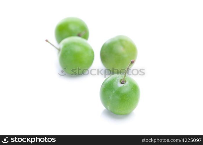 green plum isolated on white