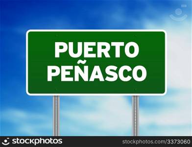 Green Puerto PeAasco, Mexico highway sign on Cloud Background.