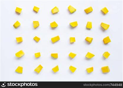 Green pumpkin vegetable cube slices isolated on white background. Top view