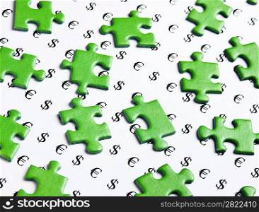 green puzzles and symbols of money