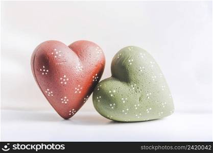 green red christmas hearts white background