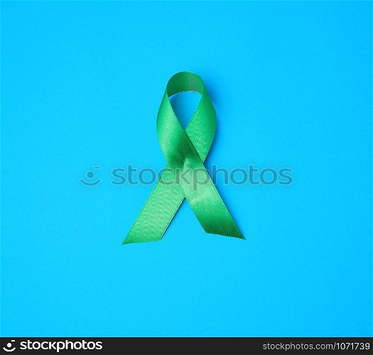 green ribbon as a symbol of early research and disease control, symbol of Lyme disease, kidney transplantation and organ donation