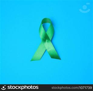 green ribbon as a symbol of early research and disease control, symbol of Lyme disease, kidney transplantation and organ donation