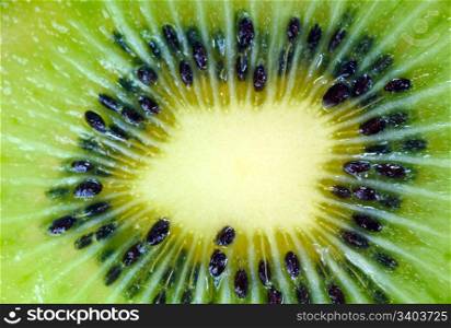 Green ripe kiwi macro with seeds