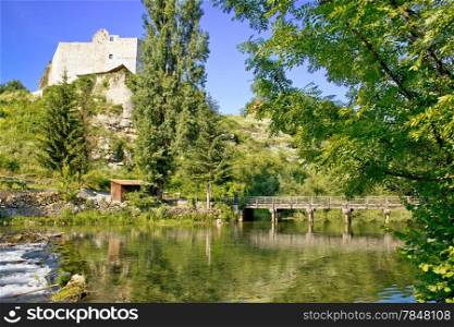 Green river and stone fortress in Slunj, Croatia