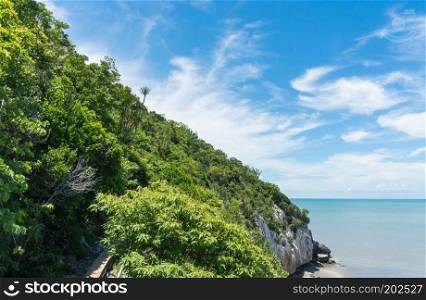 Green Rock or Stone Mountain or Hill and blue sky and walking way at Laem Sala Prachuap Khiri Khan Thailand. Landscape or scenery summer 
season concept