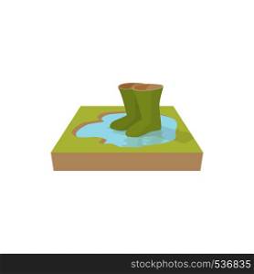 Green rubber boots in a puddle icon in cartoon style on a white background. Green rubber boots in a puddle icon, cartoon style