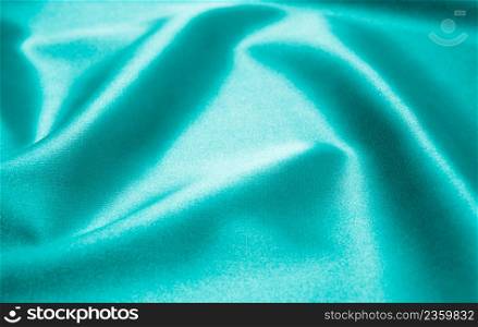 Green satin fabric as background