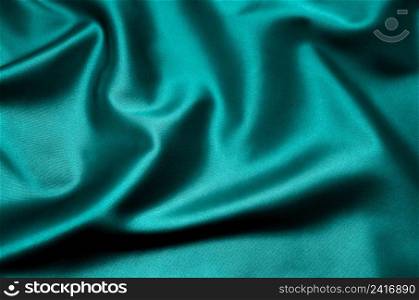 Green satin fabric as background