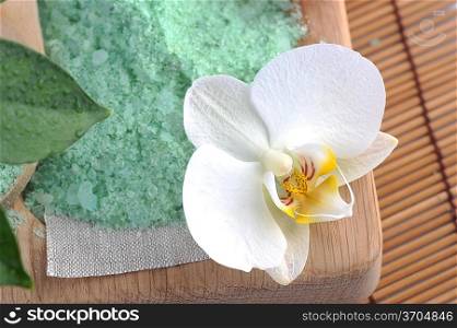 Green sea salt for bathing isolated on straw napkin