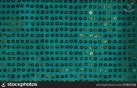 Green shiny sequine background texture abstract cloth. Elegant sequined sparkling textile close up