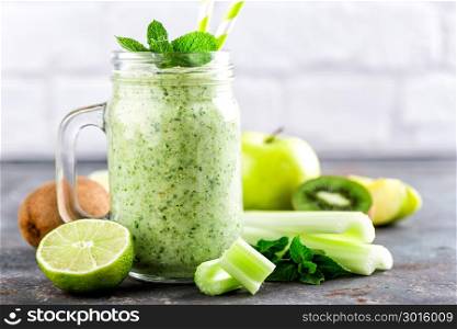 green smoothie with celery, apple, kiwi and lime. healthy diet eating, superfood