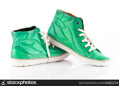 green sneakers isolated on white background