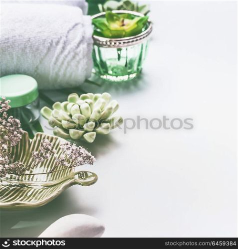 Green Spa treatment setting on white background with copy space