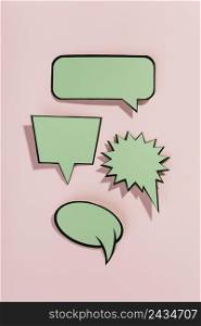 green speech bubbles with black border pink background