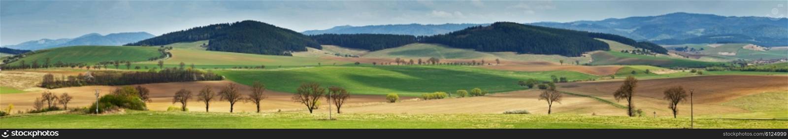 Green spring hills in Slovakia. April sunny countryside panorama