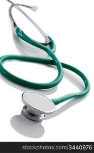Green stethoscope isolated over white background