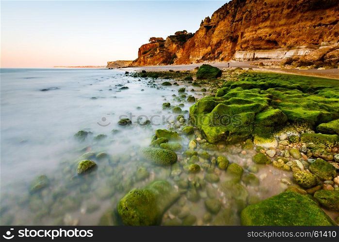 Green Stones at Porto de Mos Beach in Lagos, Algarve, Portugal
