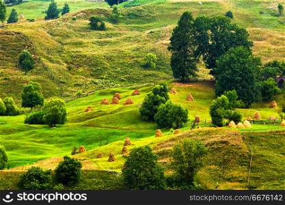 Green summer landscape scenic view. Green hills in mountain valley. Summer mountain landscape.. Green hills. Summer haymows on meadow