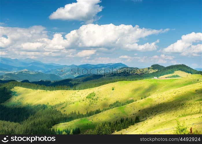 Green sunny valley in mountains and hills. Nature landscape