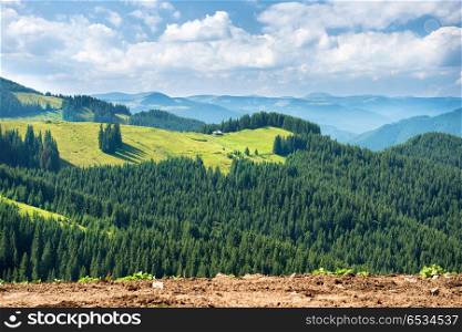 Green sunny valley in mountains and hills. Nature landscape. Green sunny valley in mountains