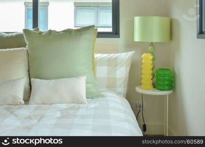 Green table lamp with green color scheme bedding