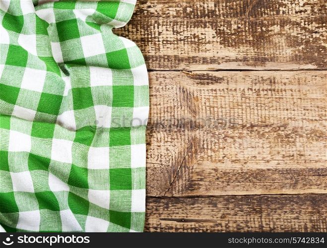 green tablecloth on old wooden table