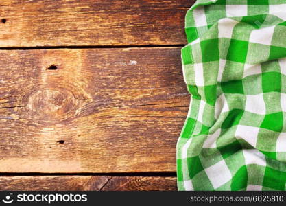 green tablecloth on old wooden table