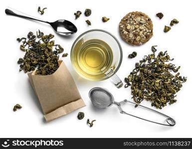 Green tea and accessories top view on white background.. Green tea and accessories top view on white background