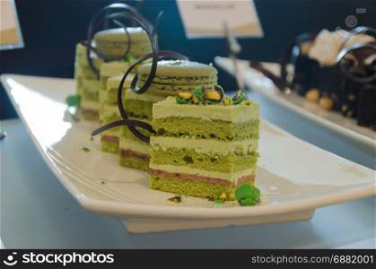 Green tea cake on dish.